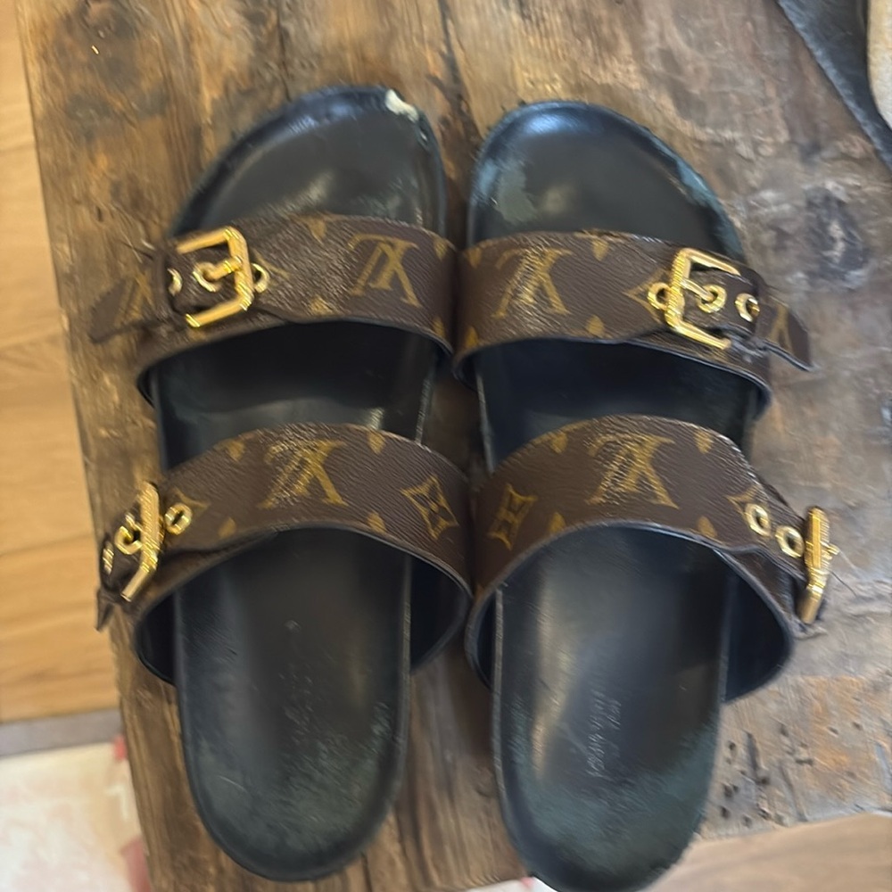 Well lived in authentic Louis Vuitton bon Dia sandals.  Classics.
